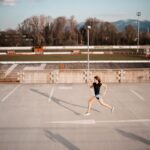 a woman running on a parking lot