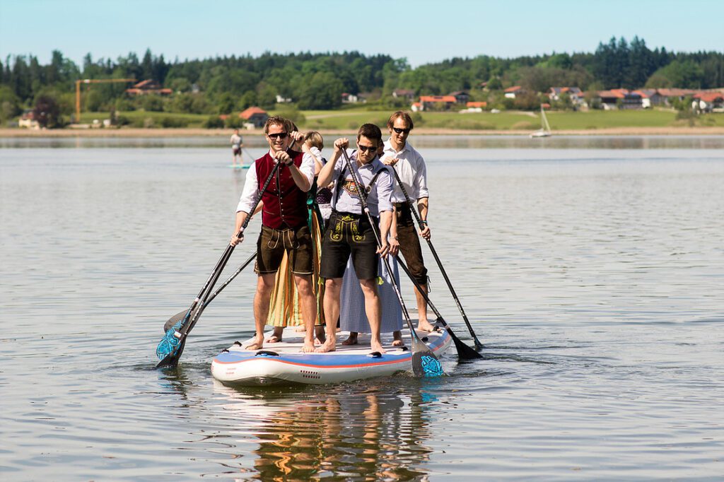 a group of men on a paddle board