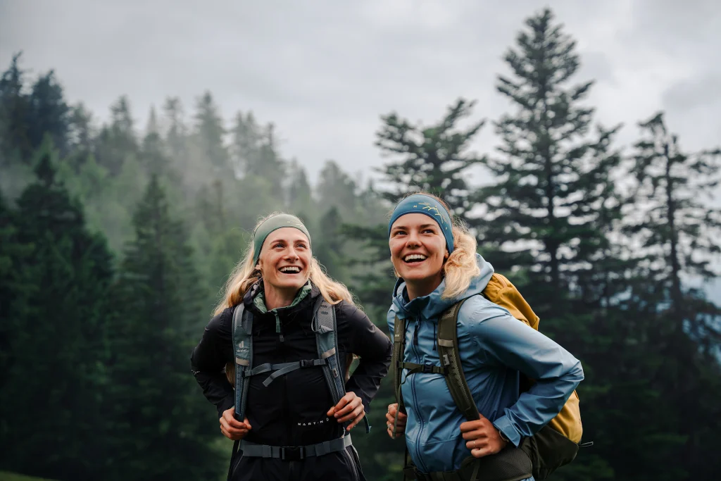 Two ladies on the mountain in rain jackets from Martini